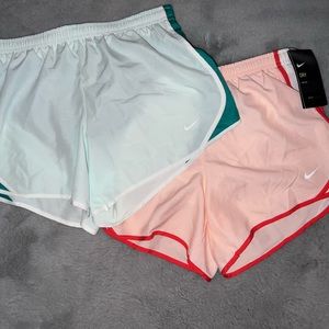 2 pairs of girls nike running shorts, size large.
